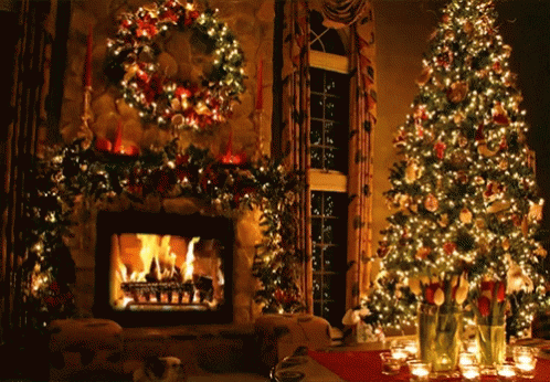 A Living Room Decorated For Christmas With A Fireplace And Christmas Trees GIF