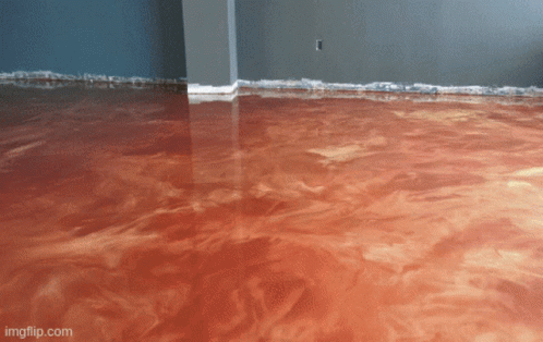 A Living Room With Blue Floors And A Couch And Chair GIF