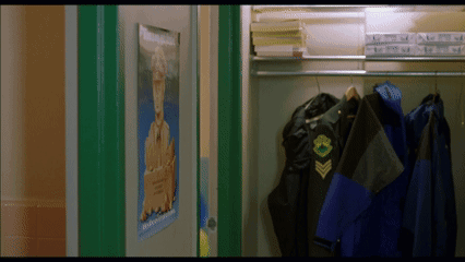 A Locker With A Poster On The Door That Says ' Military ' On It GIF