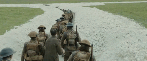 Soldiers Walking Down Dirt Road GIF