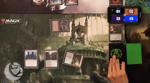 A Magic The Gathering Game Is Being Played On A Ultra Pro Mat GIF