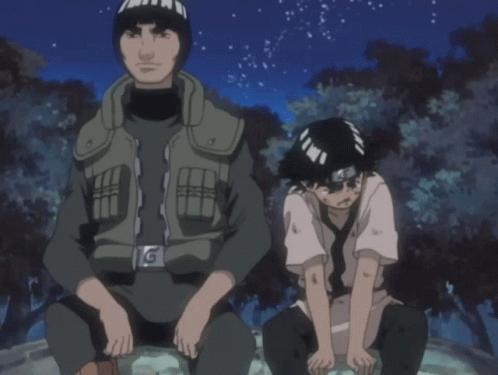 A Man And A Boy Are Sitting Next To Each Other And The Boy Has A Bandana On His Head GIF
