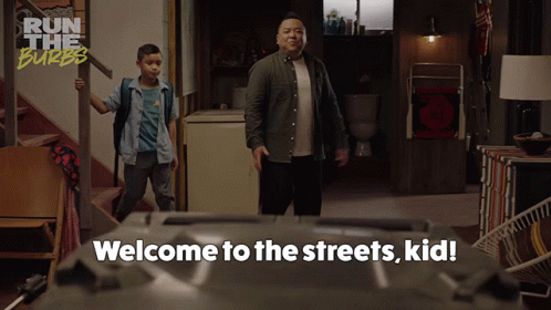A Man And A Boy Are Standing In A Room With The Words Welcome To The Streets Kid Written On The Bottom GIF
