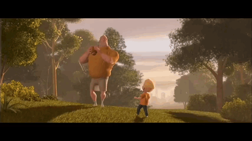 A Man And A Boy Are Standing On A Grassy Hillside GIF