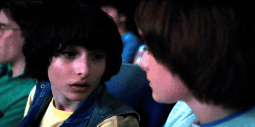 A Man And A Girl Are Looking At Each Other GIF