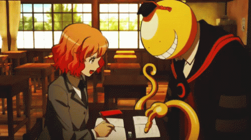 A Man And A Girl Are Sitting At A Desk In A Classroom And The Girl Is Writing In A Notebook GIF