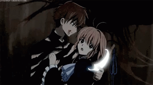 A Man And A Girl Are Standing Next To Each Other In A Dark Room . GIF