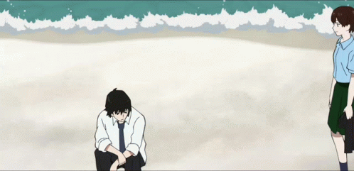 A Man And A Girl Are Standing On A Beach With The Ocean In The Background GIF