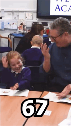 A Man And A Little Girl Are Sitting At A Table With The Number 67 On The Bottom GIF