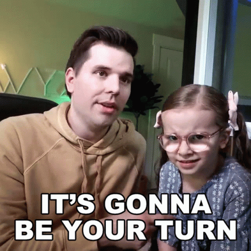 A Man And A Little Girl Are Sitting Next To Each Other With The Words " It 'S Gonna Be Your Turn " Above Them GIF