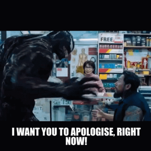 Man And Monster In Store With Apologize Sign GIF