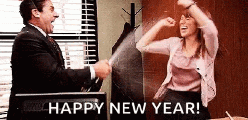 A Man And A Woman Are Celebrating A New Year . GIF