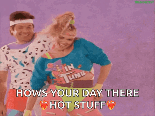 A Man And A Woman Are Dancing And The Woman Is Wearing A Shirt That Says In Tune . GIF