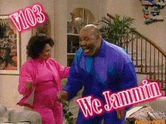 a man and a woman are dancing in a living room with a sign that says we jammin ..