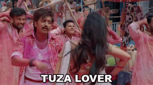 A Man And A Woman Are Dancing In Front Of A Crowd With The Words Tuza Lover Above Them GIF