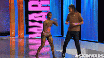 a man and a woman are dancing in front of the word skin wars