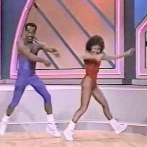 a man and a woman are dancing on a stage on a show .