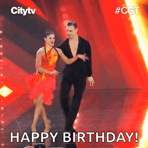 a man and a woman are dancing on a stage with the words happy birthday .