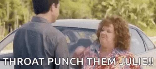 A Man And A Woman Are Fighting In Front Of A Car And The Woman Is Saying `` Throat Punch Them Julie ! '' GIF