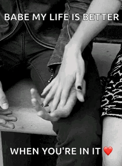 A Man And A Woman Are Holding Hands In A Black And White Photo With A Quote . GIF