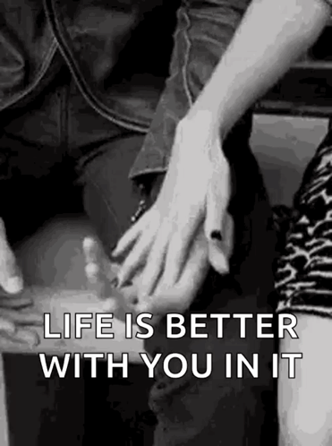 A Man And A Woman Are Holding Hands In A Black And White Photo With The Words `` Life Is Better With You In It '' . GIF