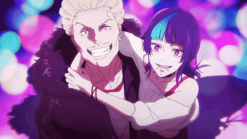 A Man And A Woman Are Hugging Each Other And Smiling For The Camera GIF