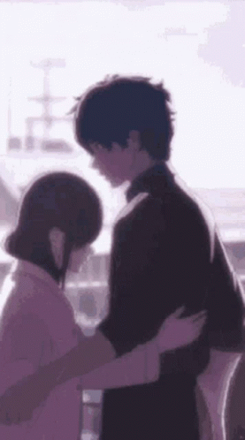 A Man And A Woman Are Hugging Each Other In A Purple Background . GIF
