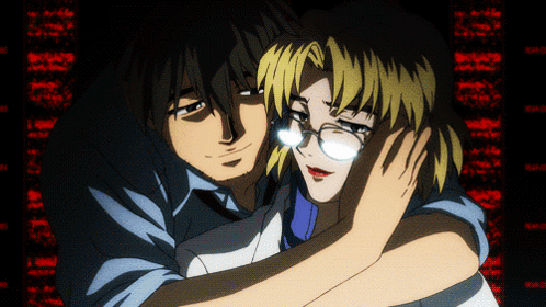 A Man And A Woman Are Hugging Each Other In Front Of A Screen That Says ' I Love You ' On It GIF