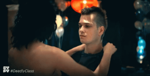 A Man And A Woman Are Hugging In A Scene From The Tv Series Deadly Class GIF