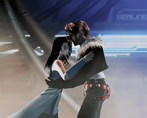 A Man And A Woman Are Hugging In Front Of A Sign That Says Scene GIF