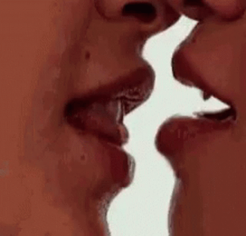 A Man And A Woman Are Kissing Each Other . GIF