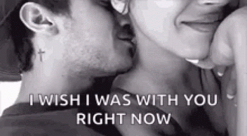 A Man And A Woman Are Kissing In A Black And White Photo . The Man Has A Cross Tattoo On His Neck . GIF