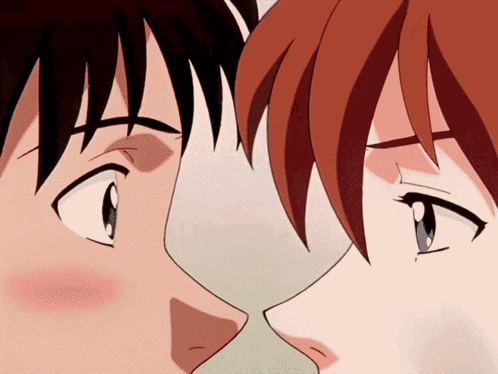 A Man And A Woman Are Kissing In A Cartoon GIF