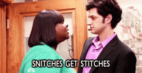 A Man And A Woman Are Kissing In Front Of A Door And The Woman Is Saying `` Snitches Get Stitches '' . GIF
