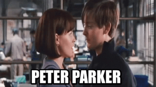 A Man And A Woman Are Kissing In Front Of A Sign That Says Peter Parker On It . GIF