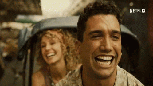 A Man And A Woman Are Laughing And Netflix Is Visible In The Corner GIF