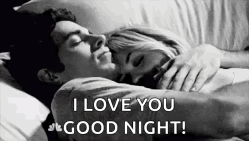 A Man And A Woman Are Laying In Bed Hugging Each Other And The Man Is Saying `` I Love You Good Night '' . GIF