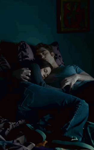 A Man And A Woman Are Laying On A Couch And The Woman Is Sleeping GIF