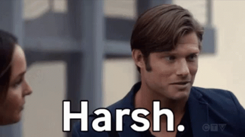 Man And Woman Looking At Each Other Saying Harsh GIF
