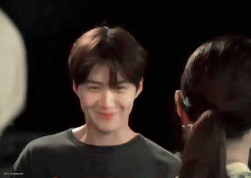 A Man And A Woman Are Looking At Each Other And The Man 'S Shirt Says Sin Moment GIF