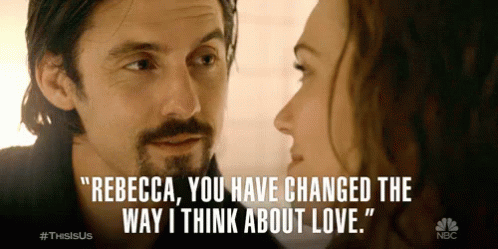 A Man And A Woman Are Looking At Each Other And The Man Says Rebecca GIF