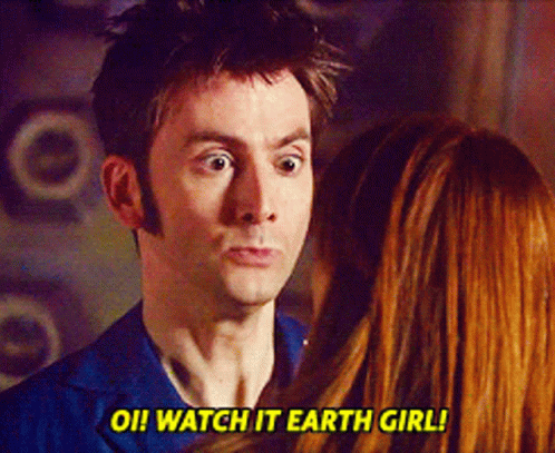 A Man And A Woman Are Looking At Each Other And The Man Says Watch It Earth Girl GIF