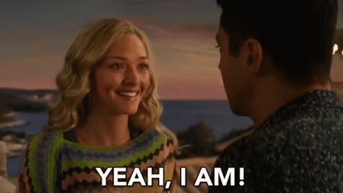 A Man And A Woman Are Looking At Each Other And The Woman Says " Yeah , I Am " GIF