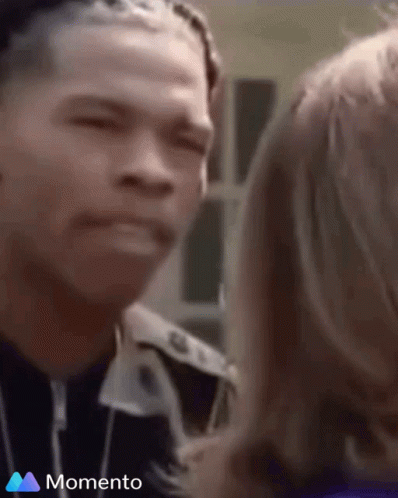 A Man And A Woman Are Looking At Each Other And The Word Momento Is On The Bottom Of The Screen GIF