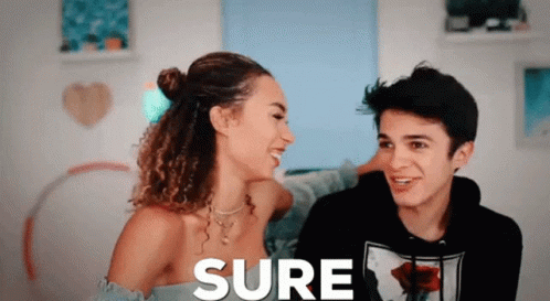 A Man And A Woman Are Looking At Each Other And The Word Sure Is On The Screen GIF