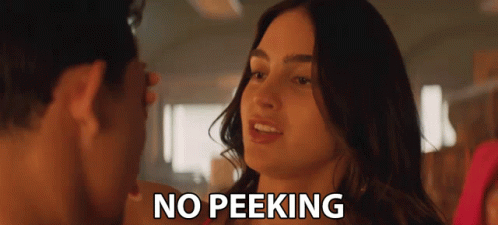 A Man And A Woman Are Looking At Each Other And The Words No Peeking Are Visible GIF