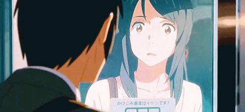 A Man And A Woman Are Looking At Each Other In A Mirror In An Anime . GIF