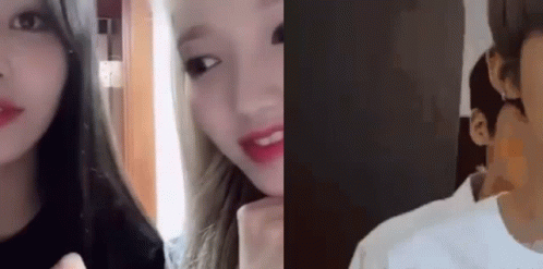 A Man And A Woman Are Looking At Each Other In A Room . GIF