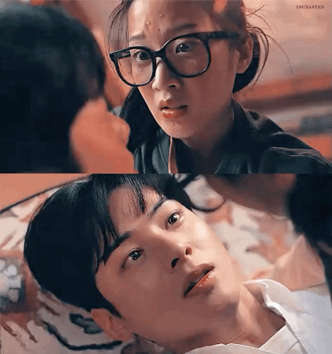A Man And A Woman Are Looking At Each Other . The Woman Is Wearing Glasses . GIF