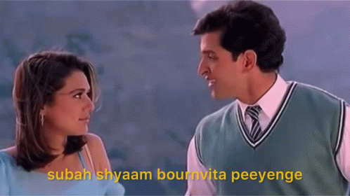 A Man And A Woman Are Looking At Each Other With A Caption That Says Sabah Shyam GIF